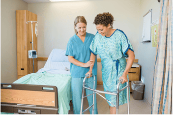 nurse helping patient during patient rounding