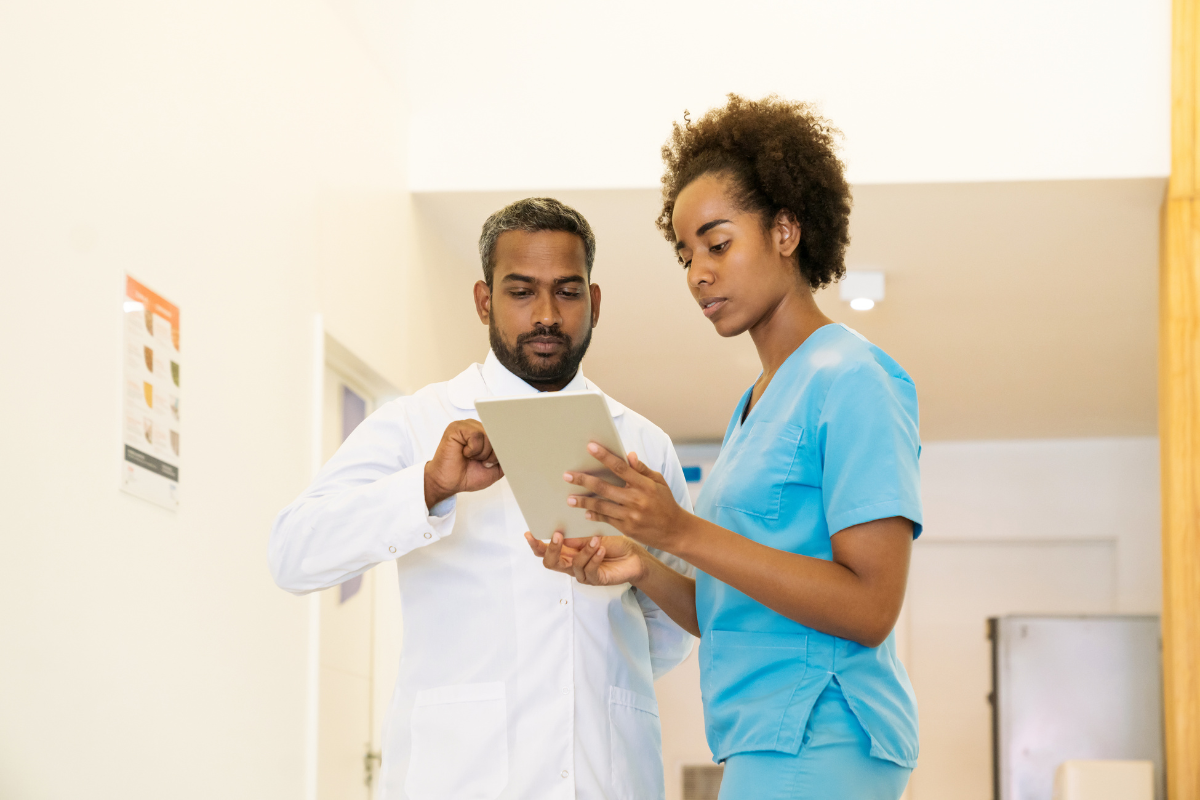 Safety in Healthcare software on tablet being used by two healthcare professionals