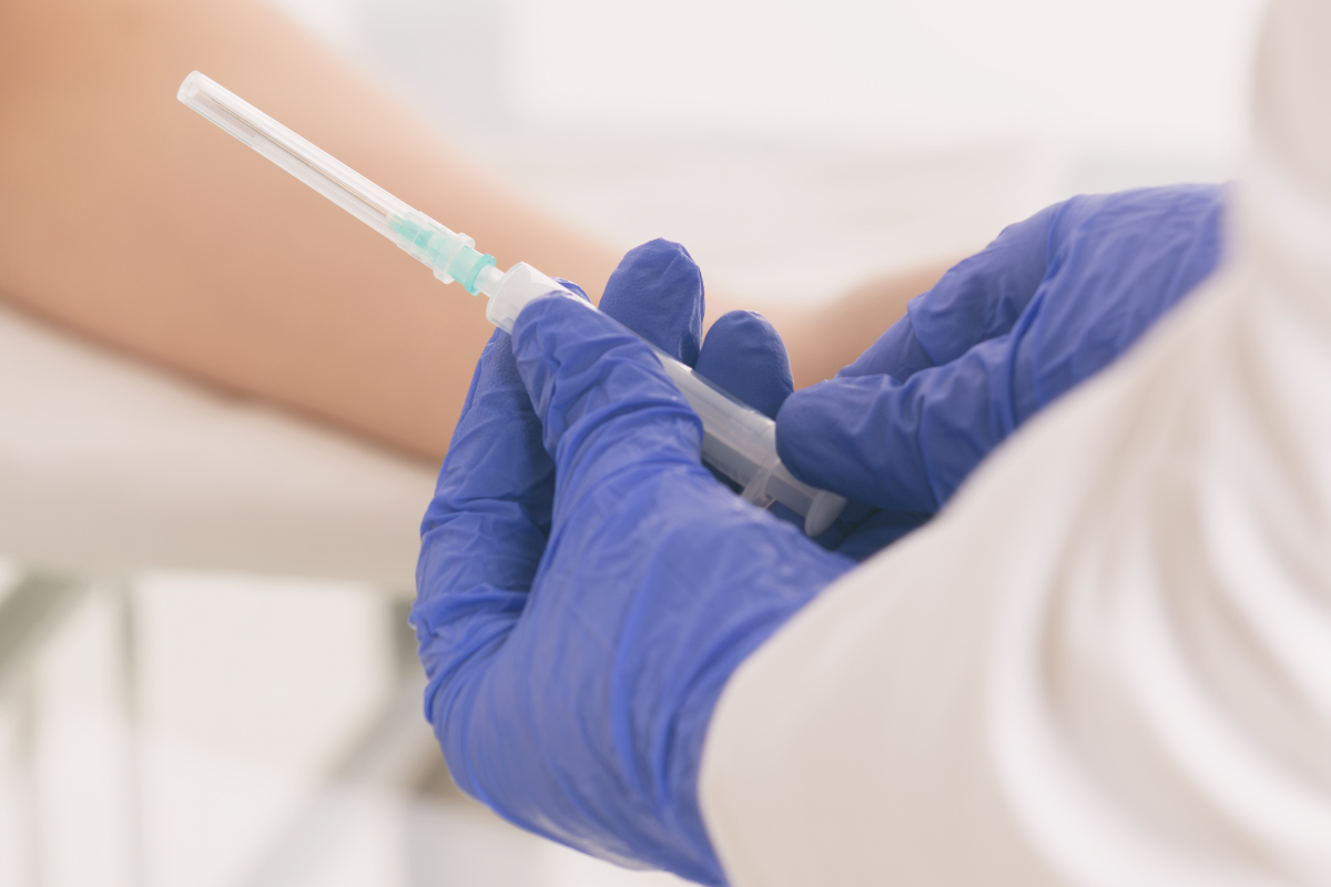 healthcare worker preventing needlestick injuries